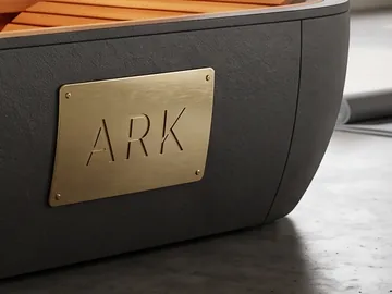 Detail: the gold ARK plaque